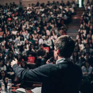 Paid public speaking gig in front of a large audience Image courtesy Miguel Henriques on Unsplash